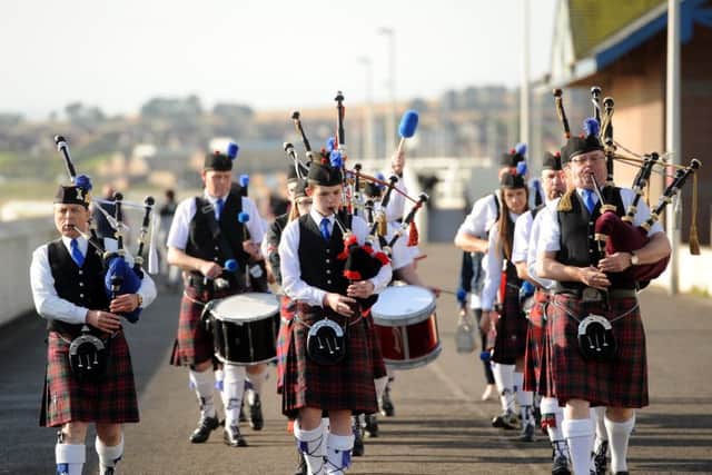 The pipers helped get last year's event into gear.