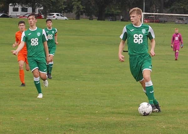 Thornton Hibs under 19s Fergus Mackie bringing the ball out of defence