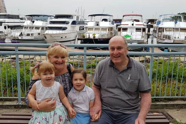 Jock Chambers with his wife Dianne and their granddaughters Chloe and Ella.