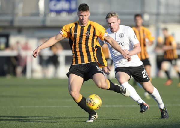 Highly rated young defender Oliver Fleming has joined Saints from Berwick.