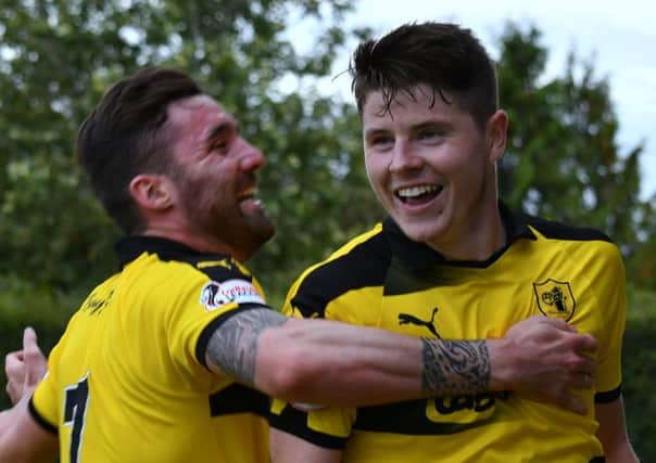 Kevin Nisbet (right) celebrates his penalty strike with team mate Chris Duggan. Pic: Eddie Doig