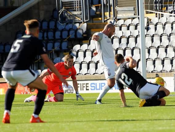 Montrose defender Iain Campbell diverts Ross Matthews' effort into his own net for Raith's equaliser. Pic: Fife Photo Agency