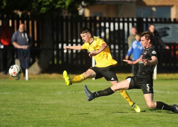 Youngster Reece Brown smashes hom Burntisland's equaliser. (c) David Wardle