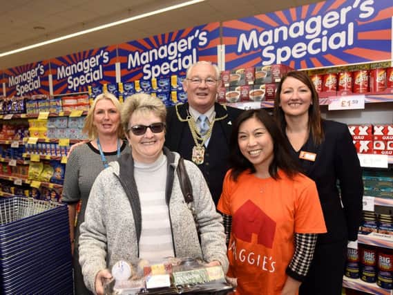 The store opening with Lynn Walker, manager, first customer Sharon Reynolds, Provost Leishman, Tumong Edwards from Maggie's and Carol Lyndsay, area manager.
