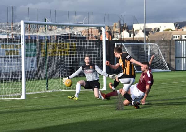 Anton Dowds causes problems for the Stenny defence. Pic by Kenny Mackay.