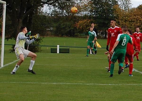 Scott Orrock heads home the seventh for Thornton Hibs against Stonewood Parkvale