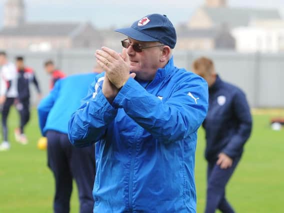 John McGlynn applauds the travelling Raith supporters at full-time in Dumbarton on Saturday. Pic: Alba Pictures Ltd