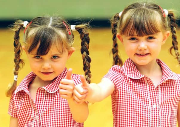 Twins Casey & Callie McDonnell are enjoying life in primary 1. Picture: Walter Neilson