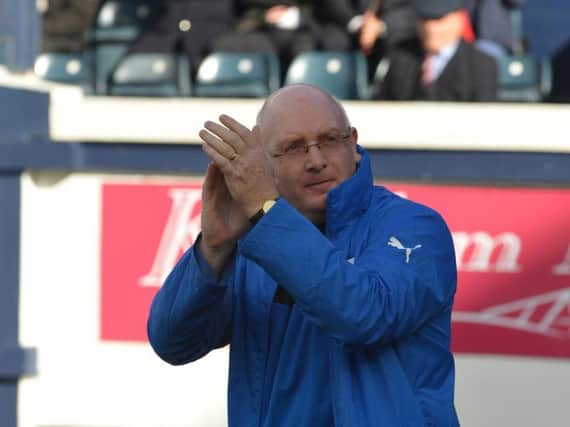 John McGlynn applauds the Raith fans as he makes his way out the tunnel for his first game back at Stark's Park on Saturday. Pic: George McLuskie