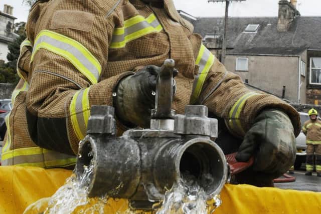 The firefighters run a drill outside.  Picture: George McLuskie