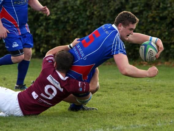 Struan Robertson dives over for the first try. Pic: Michael Booth