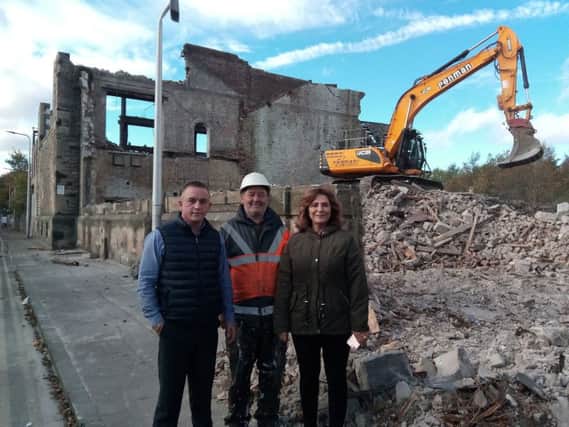 Last days of old Victoria Road power station. L-r: Blair Dryburgh, managing director of Blair Group which carried out the work; Donald Morrison, site manager; and Diana Josephs, owner.