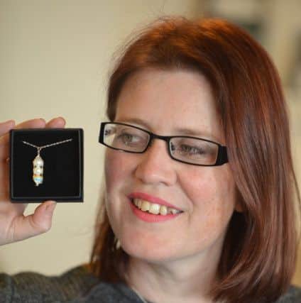Louise Humpington, of LevÃ®ko Designs, has designed a range of 'Peas in a Pod' pendants to commemorate angel babies and celebrate the birth of rainbow babies. Pic: George McLuskie.