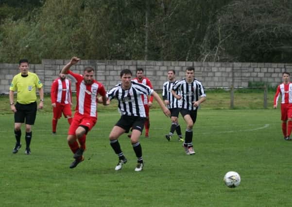 Newburgh break out of the defence during Saturday's defeat. Pic by Graeme Strachan.