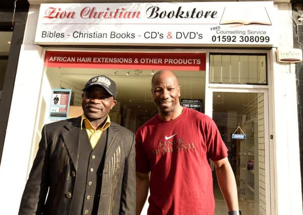Pastor Joe and Marvin Andrews outside the new bookshop. Pic by FPA