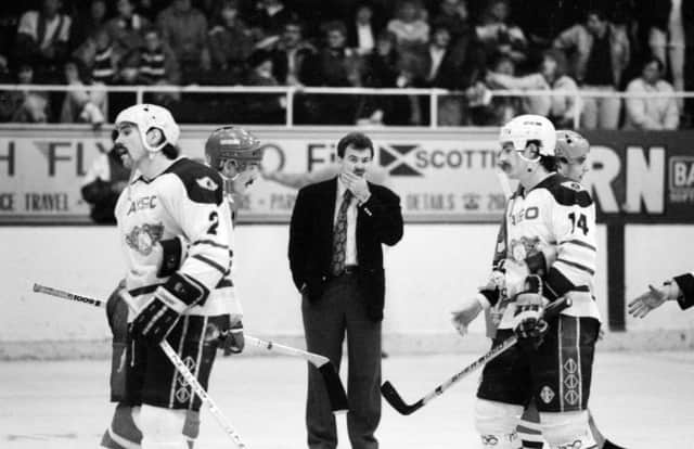 Fife Flyers,  coach Mike Fedorko crosses the ice next to players Tim Couglin and Steve Gatzos  (Pic: Bill Dickman/Fife Free Press)