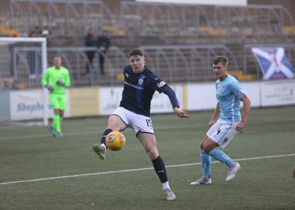 Kevin Nisbet of Raith, left, collects a pass, watched by Darren Whyte of Forfar (picture by Christopher Coutts).