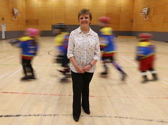 Cllr Judy Hamilton, pictured with some of the Glenrothes Grizzlies roller hockey players,  is welcoming the news