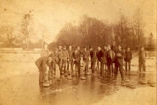 Aberdour Curling Club members on Otterson Loch in 1890.