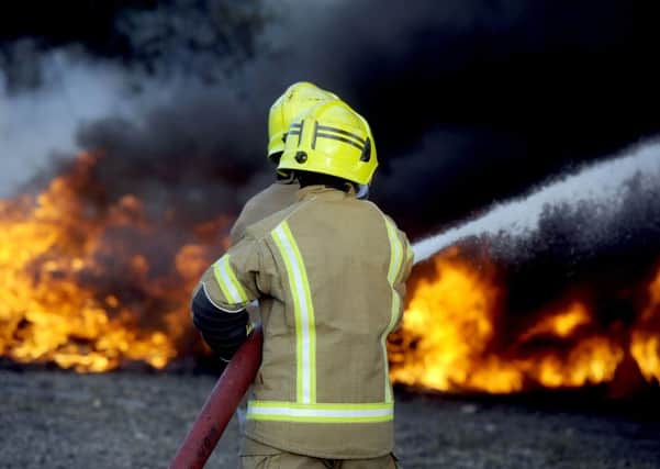 Firefighters attend a fire where old tyres had been deliberately set alight.