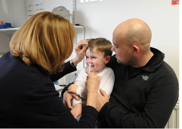 Joshua 4 gets his flu vaccination from Practise Nurse Liz Gilespie. at Nothglen Medical Practice Glenrothes.