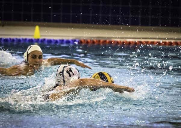 Saints women's water polo side on the attack.
