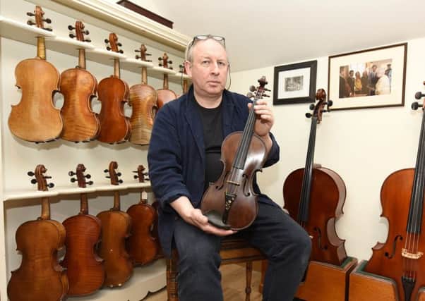 David Rattray with the Robert Dunsire violin. Pic credit: WALTER NEILSON.
