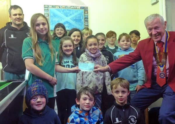 Freuchie Cricket Club juniors- the Freuchie Fliers- received a generous cheque from the Howe of Fife Rotary.