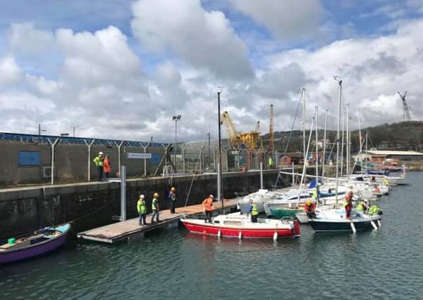 Burntisland Sailing Club members installing the pontoons