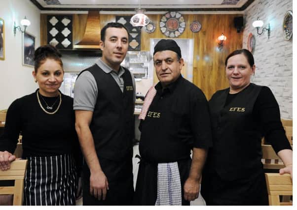 New Kirkcaldy restaurant owner Hasan Dogan, second left, with members of his staff. (Pic George McLuskie).
