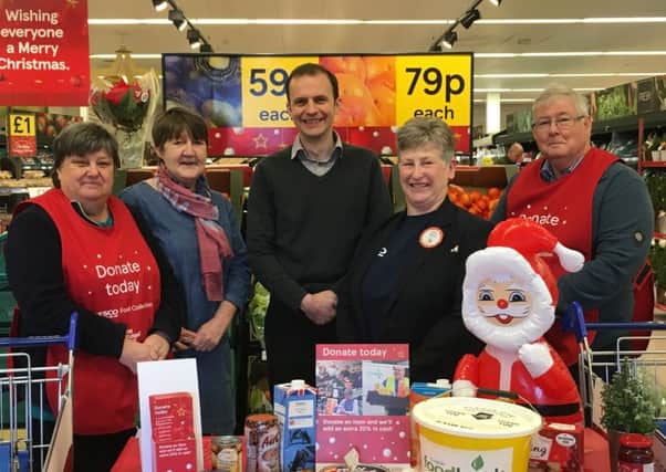 Mr Gethins, centre, Ms Findlay, second from left, and Elaine Brailsford from Tesco, second from right, with volunteers.