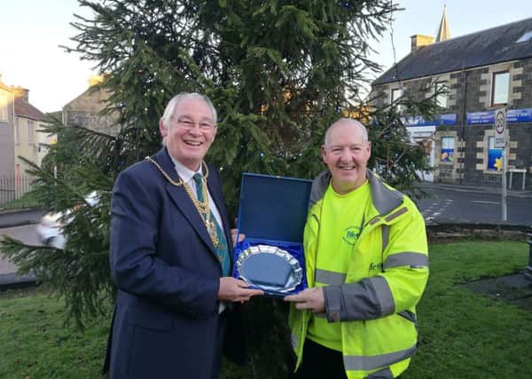 Jim Peebles accepts the award from Fife Provost Jim Leishman.