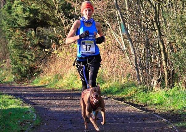 Falkland Trail Runners: Louise Lessells and dog Jem who were among the prizes in the Lochore Meadows Canicross event