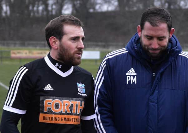 Kennoway's Craig Johnstone with Carnoustie boss Phil McGuire.