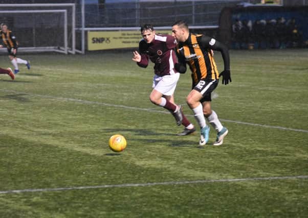 Scott McBride works his way into the box at Ochilview. Pic Kenny Mackay.