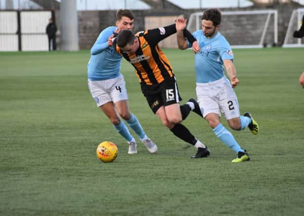 Anton Dowds muscles his way through the Forfar defence.