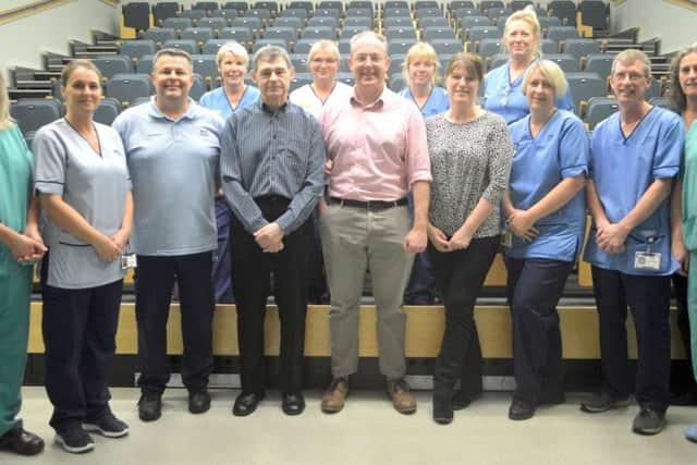 First patient, Michael Sullivan, from Kennoway, is pictured with the surgery team
