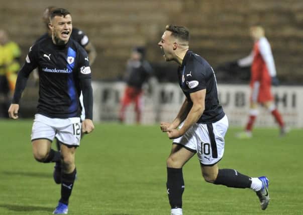 Lewis Vaughan (right) celebrates after scoring Rovers' fourth goal against Dumbarton last Saturday.