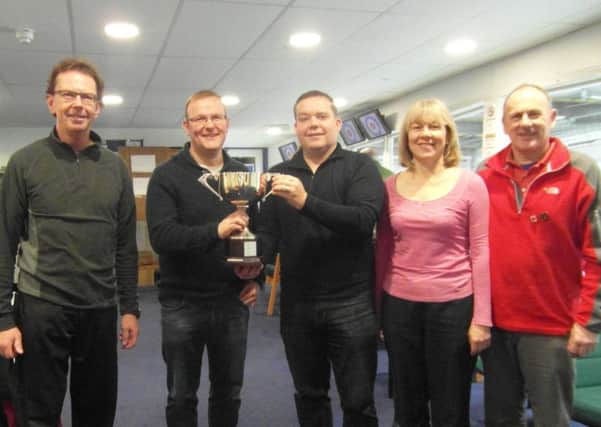 The presentation of the Otago Trophy to the winning rink at the New Year Bonspeil.