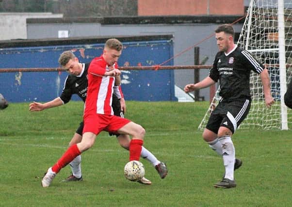 Newburgh, in red and white, struggled to contain their hosts. Pic by Graham Strachan.