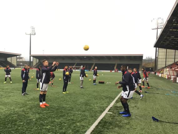Raith Rovers players warm up ahead of the match at the Penny Cars Stadium. Pic: Walter Neilson