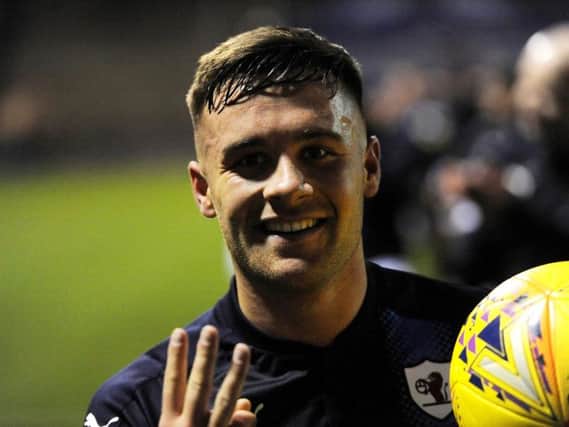 Lewis Vaughan holds up three fingers, and the match ball, after his derby hat-trick sealed a 3-0 win for Raith Rovers over Dunfermline in the Scottish Cup fourth round. Pic: Fife Photo Agency