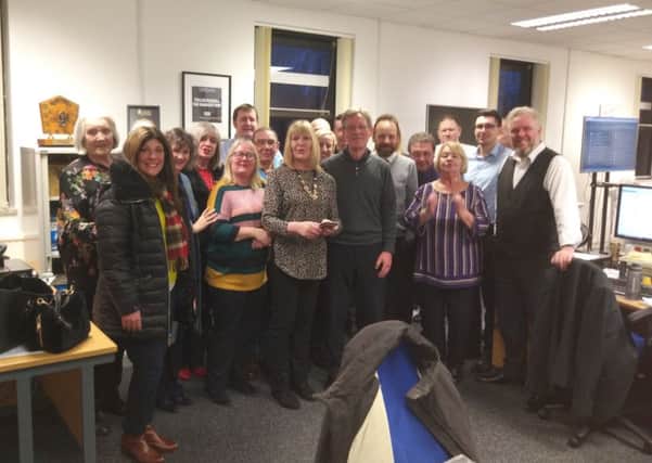 George Duncan, pictured centre with his wife Margaret, celebrated 50 years' service with current and former staff at the Fife Free Press office.
