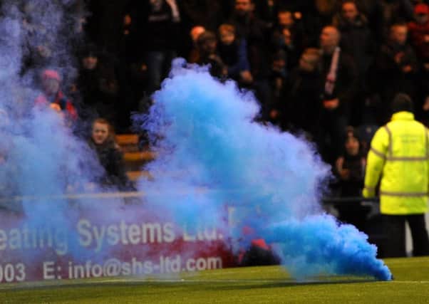 Three smoke bombs were thrown. Picture: Fife Photo Agency