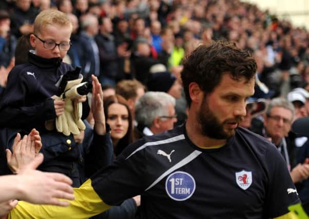 Kevin Cuthbert gives his gloves to a young Raith fan at the end of the play-off defeat to Hibs in 2016. Pic: Fife Photo Agency