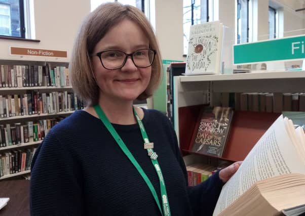 Susan Ness in the library at Kirkcaldy Galleries
