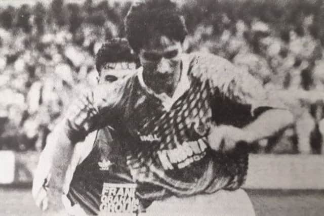 Martin Nelson in action against Hibs