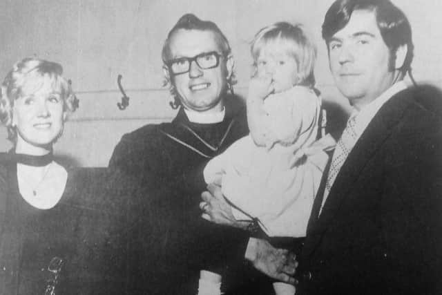 St John's Church, Kirkcaldy, destroyed by fire in 1975.  Days after the blaze, the Rev Samuel McNaught conducted a christening in the church's temporary home in Meikle's Carpet Factory. He is pictured with baby  Heather Ann Schulenberger, and parents Mrs and Mrs John Schulenberger who had flown 3000 miles from  Morrestow, New Jersey to ensure their child was the third generation of their family baptised at St John's (Pic: Fife Free Press)