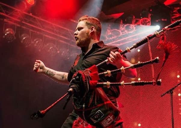 Cameron Barnes of the Red Hot Chilli Pipers performing.