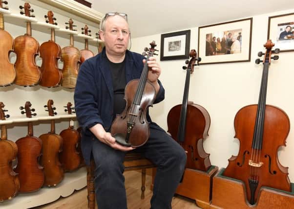 David Rattray with the Robert Dunsire violin. Pic: Fife Photo Agency.